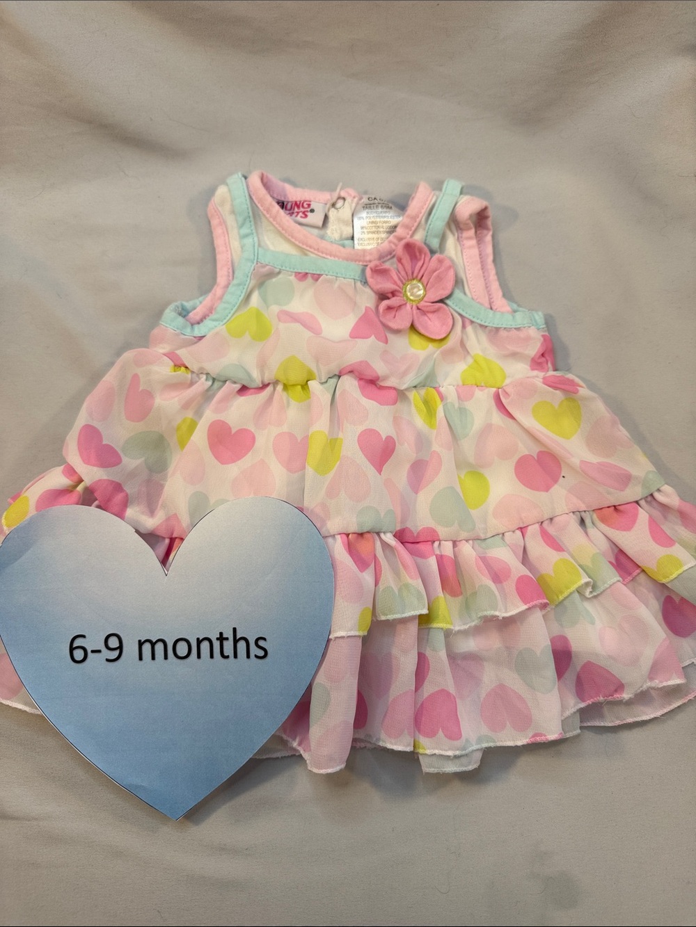 Pink Ruffle Baby Dress with Flower Accent
